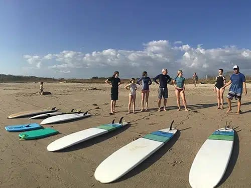 group surf lessons guiones