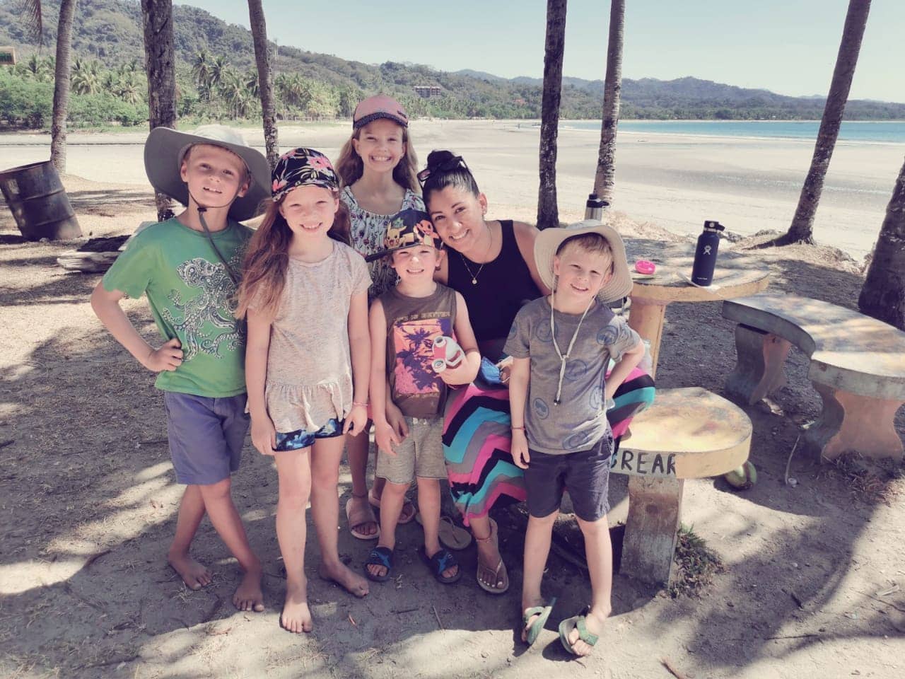 Kids practicing their Spanish with teacher Darihana during a fun beach walk. spanish program for kids costa rica