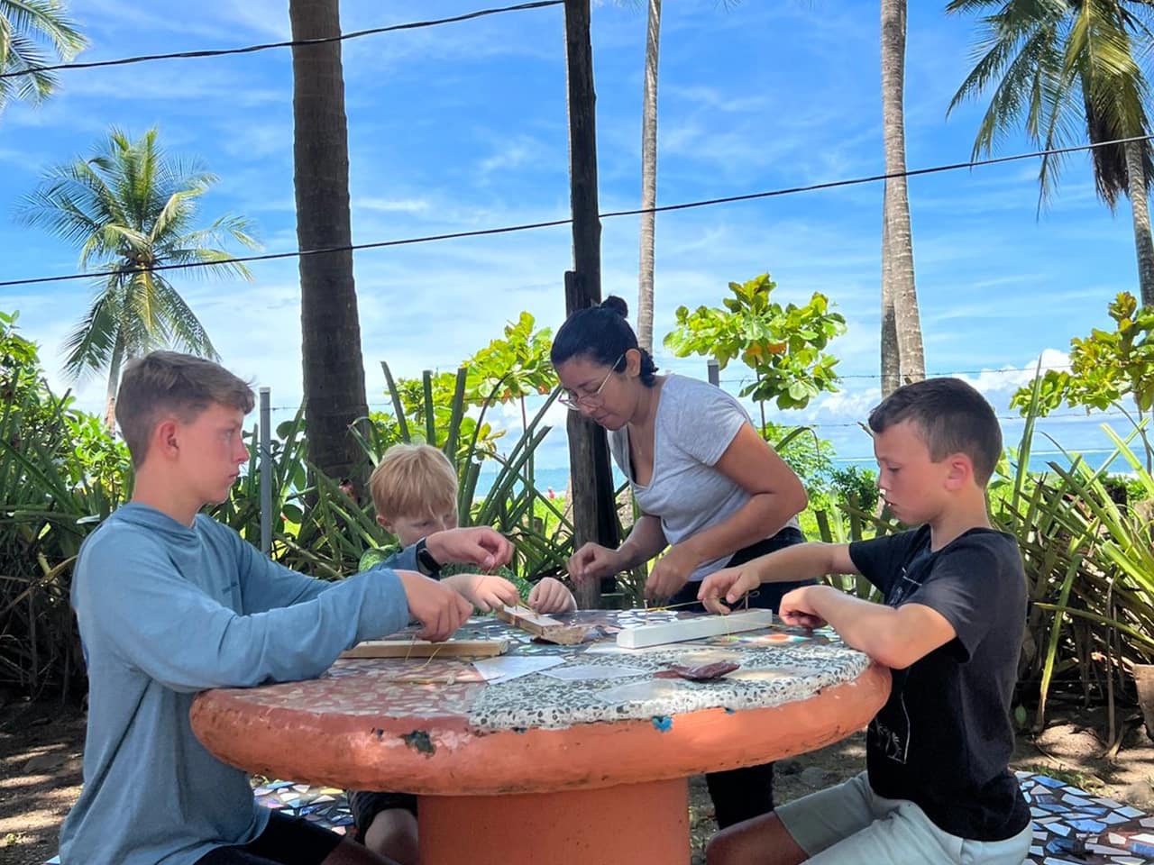 Kids fully concentrated during their outdoor classes at our beachfront campus. spanish program for kids costa rica